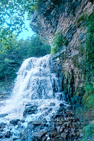 Waterfall & Overhanging Verdant Cliffs